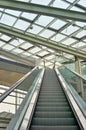 Escalator under a large glass roof