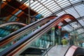 Escalator up at the station, glass, urban environment, shopping center