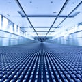 Escalator view in blue corridor Royalty Free Stock Photo