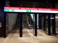Escalators, doors and info sign at the platform entrance of new Aalto University metro station