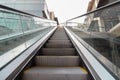 Escalators inside a mall are empty of people due to the closure of shopping centers by the government to prevent infection with th Royalty Free Stock Photo