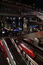 Escalators and interior Architectural details of Hauptbahnhof (Central Station) Berlin and Red trains Royalty Free Stock Photo