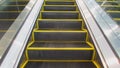 Escalators are shown that constantly run upstairs