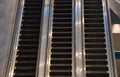 Escalators in subway train station towards upper levels, used in places where lifts would be impractical. Transportation between