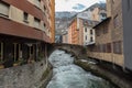 River Valira on Engordany Bridge and houses view in a snowfall day in small town Escaldes-Engordany in Andorra on January 16, 201