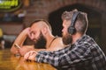 Escape reality. Friday relaxation in bar. Hipster bearded man spend leisure at bar counter. Order drinks at bar counter Royalty Free Stock Photo