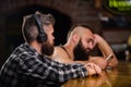 Escape reality. Friday relaxation in bar. Hipster bearded man spend leisure at bar counter. Order drinks at bar counter Royalty Free Stock Photo