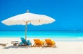 Beach chairs with umbrella and beautiful sand beach, tropical beach with white sand and turquoise wate Royalty Free Stock Photo