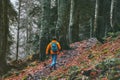 Escape into the wild man with backpack running alone in forest