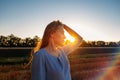 Escapism, getting away from it all, mental health, Stress resilience. Alone Young woman in linen dress walking on mowed