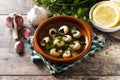 Escargots de Bourgogne. Snails with herbs and garlic butter. Royalty Free Stock Photo