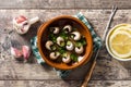 Escargots de Bourgogne. Snails with herbs and garlic butter. Royalty Free Stock Photo
