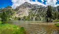 Escarpinosa green lake and waterfall in Benasque Valley, Spain