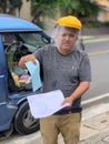 Farmer showing delivery permits during Covid-19Pandemic in Costa Rica.