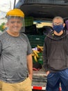 Farmers, Father and son with masks during Covid-19Pandemic in Costa Rica.