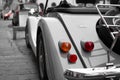 Esch-sur-Sure, Luxembourg; 08/13/2018: Desatured close up of the rear lights of a classic car parked in the street