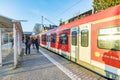 people waiting outside at the trai platform of  the S-Bahn, the public transportation system in Frankfurt for the metro Royalty Free Stock Photo