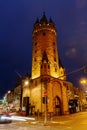 Eschenheimer Turm in front of the Nextower at the Eschenheimer Tor square at night, Frankfurt, Germany