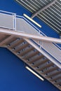 Escher stairs over blue wall Royalty Free Stock Photo
