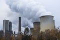 Steam clouds rising from cooling towers of power station. Royalty Free Stock Photo