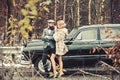 Escort of girl by security. Travel and business trip or hitch hiking. Bearded man and sexy woman in fur coat. Retro Royalty Free Stock Photo