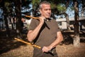 Escrima and kapap instructor demonstrates sticks fighting techniques in park