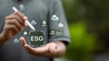 ESG digital interface with CO2 and environmental icons on hand Royalty Free Stock Photo
