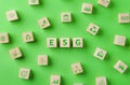 ESG Environmental Social Governance investment concept. Wooden cube with ESG word and Environment Icons on green background. Green Royalty Free Stock Photo