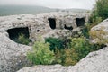 Fragments of rooms carved into the rock in the mountain town of Eski-Kermen.