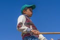 Eskisehir/Turkey-June 30 2019: Portrait of child shepherd riding donkey with his stick in his hand