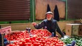 Eskisehir, Turkey - May 25, 2017: Elderly man selling tomatoes and cucumbers in Turkish local bazaar in Eskisehir.