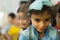 Eskisehir, Turkey - May 05, 2017: Preschool little girl wearing blue jacket enjoying being with her friends.