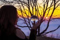 Esoteric Girl looking into the future in a Crystal Ball during a golden Sunrise in Winter Royalty Free Stock Photo