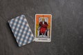 Esoteric tarot cards for fortune telling on a gray stone background