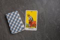Esoteric tarot cards for fortune telling on a gray stone background