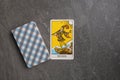 Esoteric tarot cards for fortune telling on a gray stone background