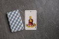 Esoteric tarot cards for fortune telling on a gray stone background