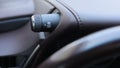 ESP button electronic stability program control. Interior detail of a modern car. The driver's finger presses