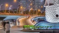 Esplanade Bridge with lights and high-rise buildings at the Marina Bay in Singapore night timelapse. Royalty Free Stock Photo