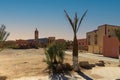 Esplanade and view of minarets of mosques in the background in Erfoud, Morocco. Royalty Free Stock Photo