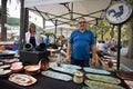 Potter selling ceramic pottery products at a local market in Esporles, Mallorca