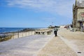 Esposende, PORTUGAL - April 22: Senior drives a bike on promenade along the Apulia beach