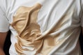 Espresso accident White fabric held by young men, stained and crinkled