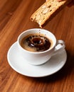 Espresso with biscotti on wooden table Royalty Free Stock Photo