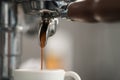 Espresso brewing with single spout portafilter on professional coffee machine