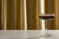 Espresso or chocolate martini cocktail on golden background Royalty Free Stock Photo