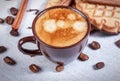 Espresso, cinnamon, cloves, cookies with chocolate on tablecloth Royalty Free Stock Photo