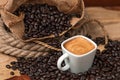 Espresso and Coffee Beans in burlap bag Royalty Free Stock Photo