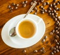 Espresso , coffee beans , water on table Royalty Free Stock Photo
