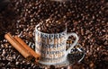Espresso coffee cup in an environment of fried coffee grains
